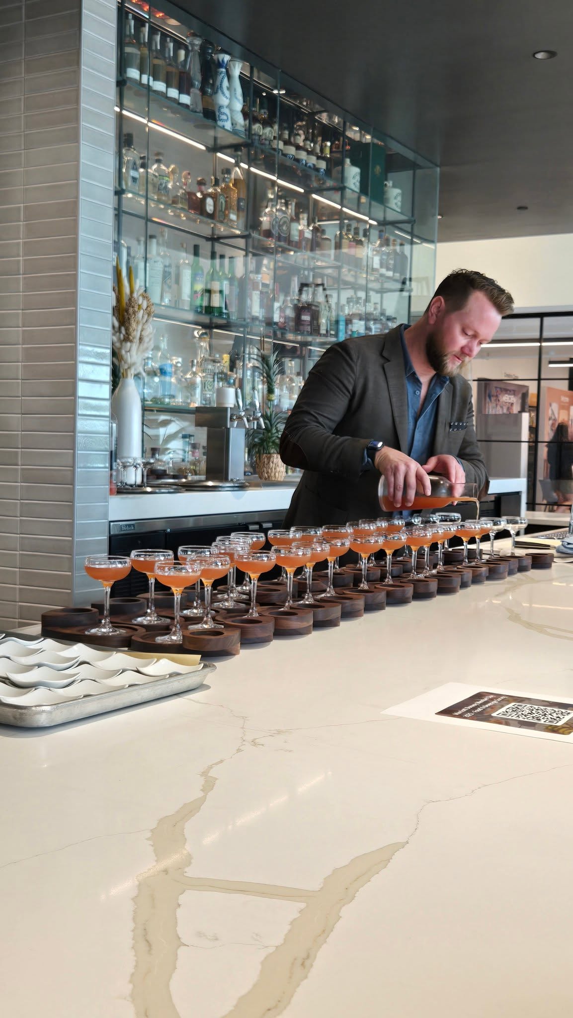 Marriott Mixologist Pouring Coupe Cocktails at Marble Bar