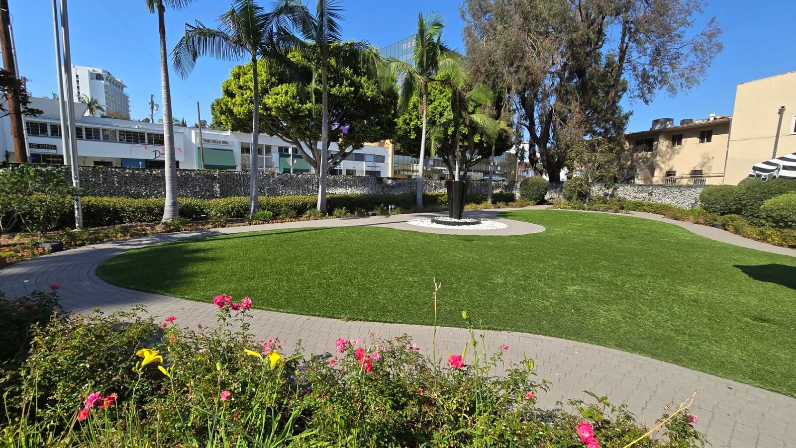 Outdoor event lawn and rose garden in daytime