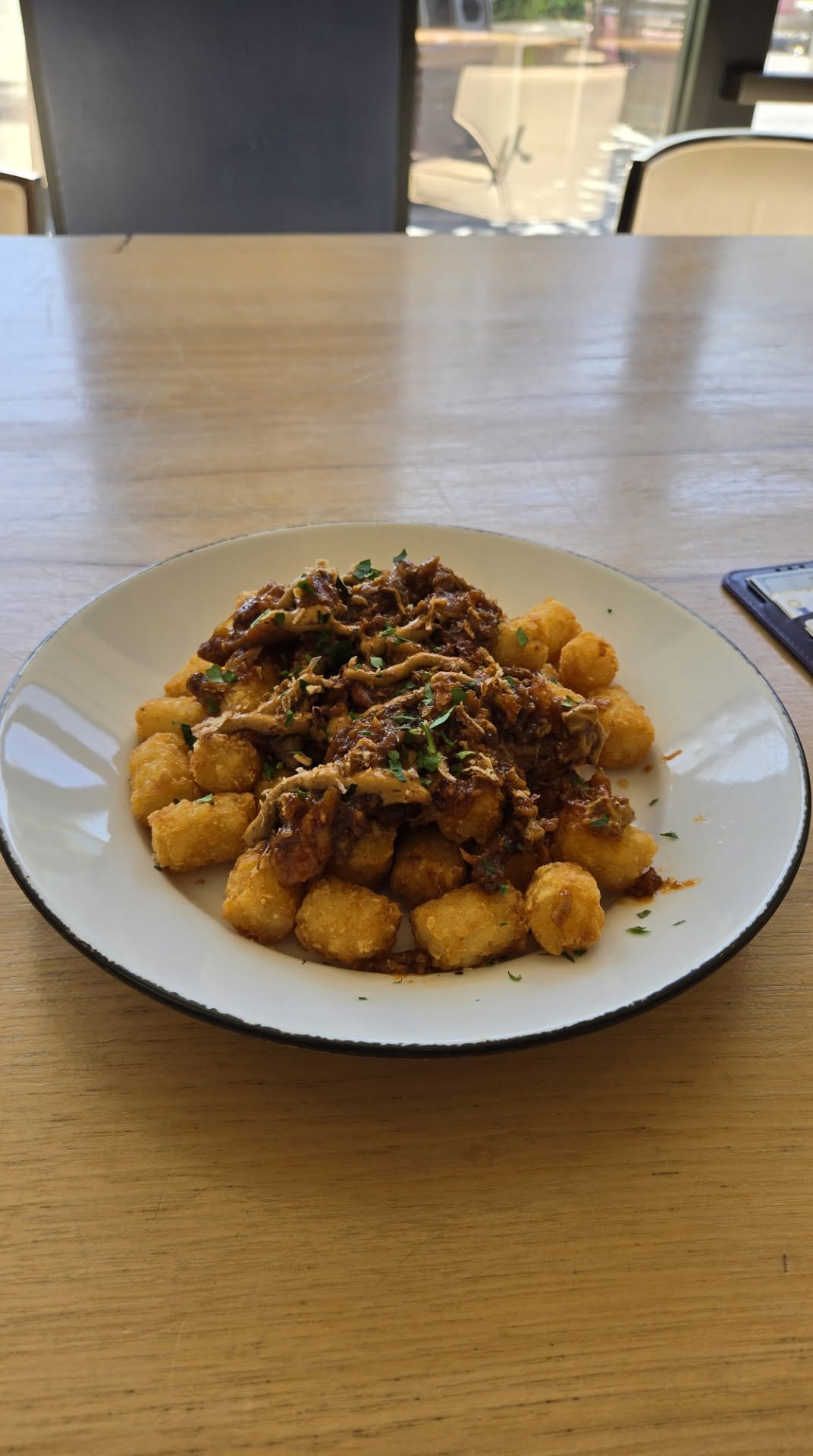 Loaded tater tots with braised pork and savory gravy