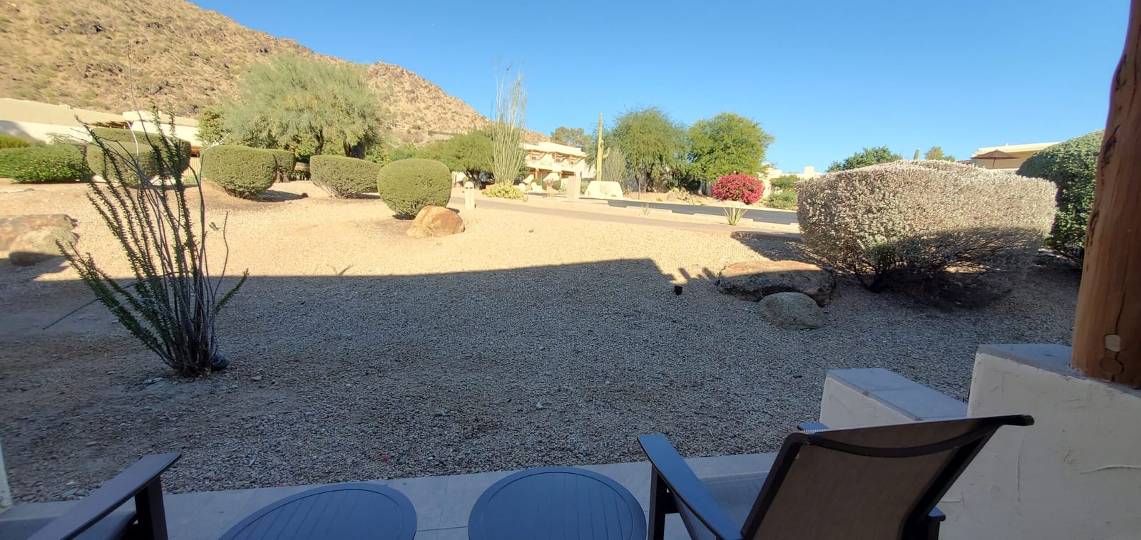 Covered patio terrace overlooking manicured Sonoran Desert xeriscaping and Mummy Mountain. Private casita patio looking out toward Mummy Mountain
